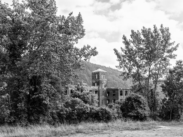 Black and white medium format photograph of the old Gilbert Knitting Mill, which operated along the Erie Canal in Little Falls, New York from the 1880s until the 1960s.