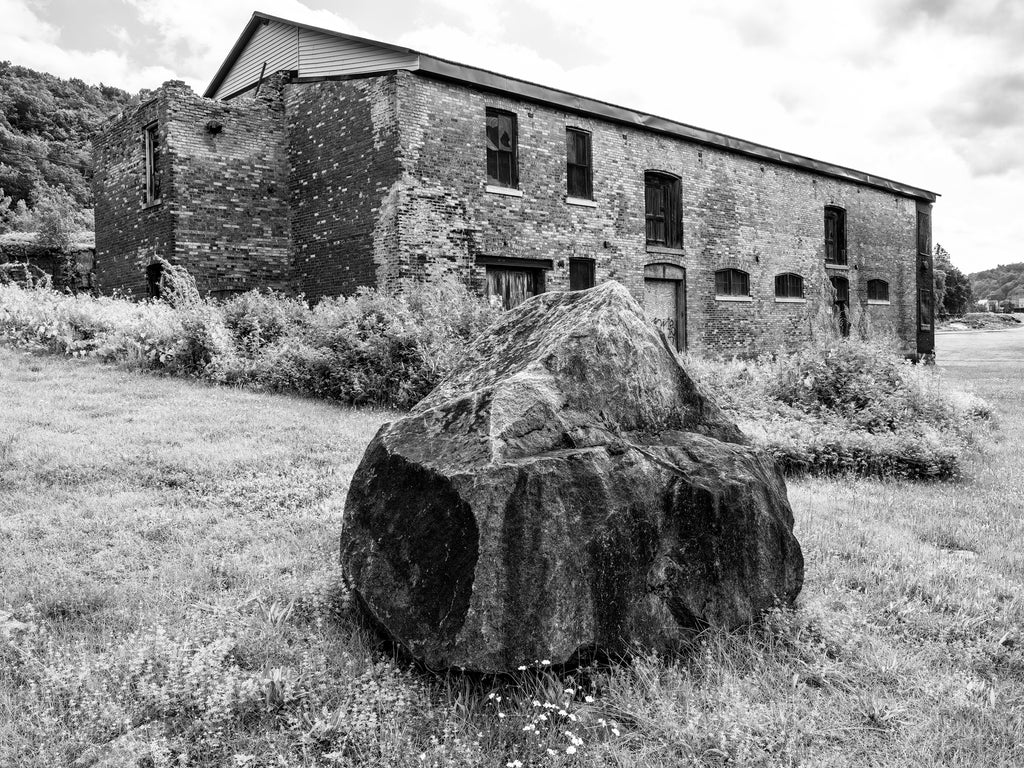 Black and white photograph of the abandoned Adirondack Woolen Mill in the small Erie Canal village of Little Falls New York