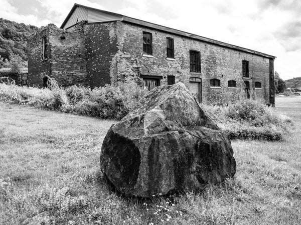 Black and white photograph of the abandoned Adirondack Woolen Mill in the small Erie Canal village of Little Falls New York