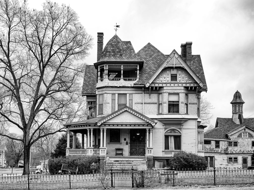 Black and white photograph of the William W. Gray Mansion, built 1885 in Grayville, Illinois. This magnificent Queen Ann-style house had a matching coach house in the back, and was the first in the region to get modern conveniences like electricity, running water, and steam heat.