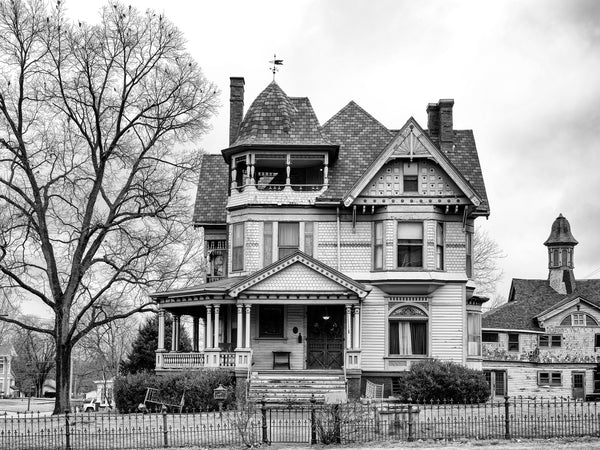 Black and white photograph of the William W. Gray Mansion, built 1885 in Grayville, Illinois. This magnificent Queen Ann-style house had a matching coach house in the back, and was the first in the region to get modern conveniences like electricity, running water, and steam heat.