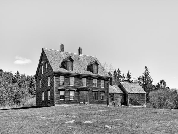 Black and white photograph of the Olson House in coastal Cushing, Maine, made famous by artist Andrew Wyeth's 1948 painting "Christina's World". Built in the late 1700s by Captain Samuel Hathorn II, the house is now owned by the Farnsworth Museum.