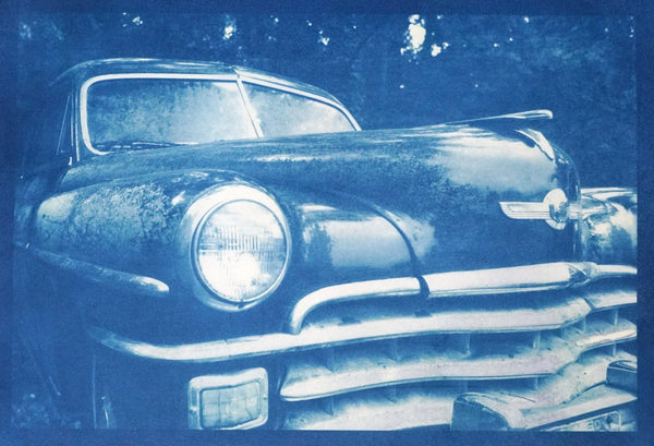 Unique, one-of-a-kind, handmade cyanotype print showing a rusty antique Chrysler automobile. The paper was hand-coated and sun-printed on high-quality Arches cold-press watercolor paper. The result is a striking blue print. Signed and dated in pencil on the back. Image area: 9-inches wide x 6-inches tall. Print only - not matted, mounted, or framed.