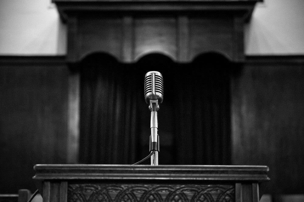 Black and white photograph of Martin Luther King's pulpit and microphone at Ebenezer Baptist Church in Altanta.