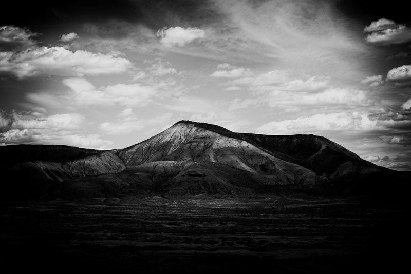 Black and white fine art landscape photograph of a mountain in late day shadows, near Gunnison, Colorado.