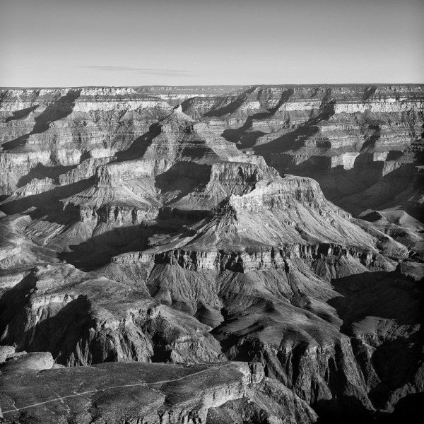 Black and white landscape photograph of the Grand Canyon, seen from the South Rim. Square format.