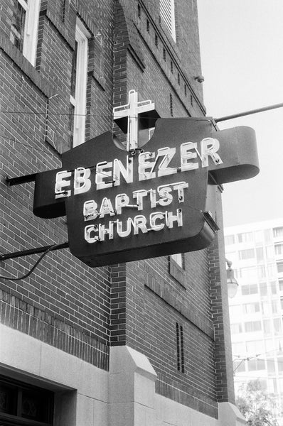 Black and white photograph of the vintage sign on the front of Dr. Martin Luther King, Jr.'s historic Ebenezer Baptist Church in Atlanta.