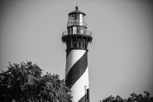 Black and white photograph of the St. Augustine Lighthouse, an active lighthouse in St. Augustine, Florida. The current lighthouse stands at the north end of Anastasia Island built in 1874.