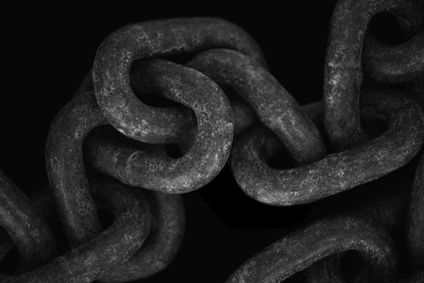Black and white photograph of the links of a very large chain, found on the waterfront in St. Augustine, Florida.