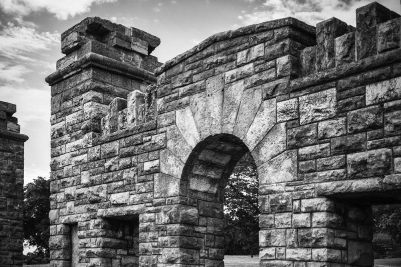 Black and white photograph of the old stone gate at the Fort Negley Civil War site in Nashville, Tennessee. Fort Negley is a star-shaped structure built of limestone blocks on a hilltop south of the city, and was the largest inland fort built during the American Civil War. The fort was built by the Union army in 1862 as a defensive post after the Confederates lost control of Nashville in successive battles, but with fighting concentrated in other areas, the fort never saw action. 
