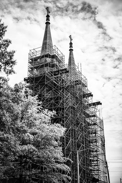 Black and white photograph of a church in downtown Birmingham, Alabama, surrounded by scaffolding.