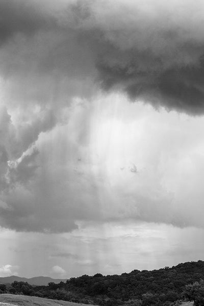 Black and white landscape photograph of a rain shower over the hills near historic Franklin, Tennessee, not far from Nashville.