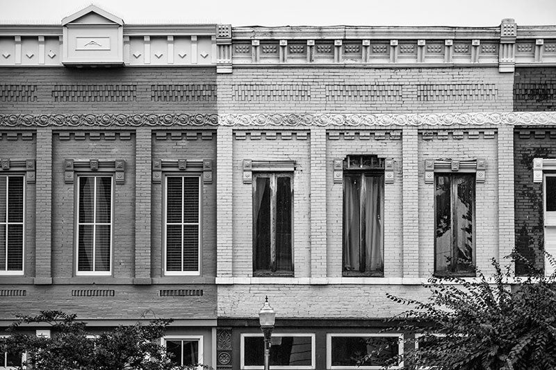 Black and white photograph of a row of historic storefronts around a southern small town courthouse square in Shelbyville, Tennessee