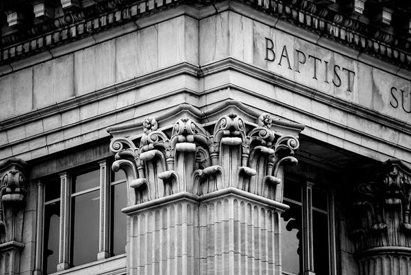 Black and white architectural detail photograph of Corinthian pilasters on the Frost Building, also known as the Baptist Sunday School Board building in downtown Nashville. The Classical Revival building was constructed on Eighth Avenue North in 1913.