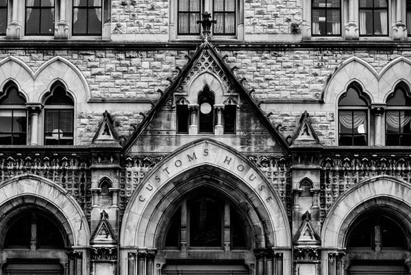 Black and white architectural photograph of the three arches and ornate stonework on the front of the Customs House on Broadway in Nashville.