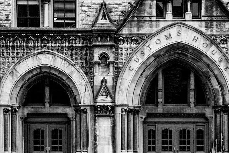 Black and white architectural photograph of the arches and ornate stonework on the front of the Customs House on Broadway in Nashville.