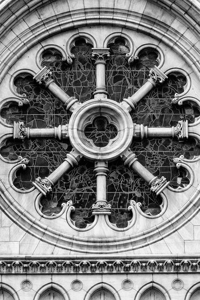 Black and white architectural photograph of the large, round stained glass window on the exterior of the historic Christ Church in Nashville, Tennessee.