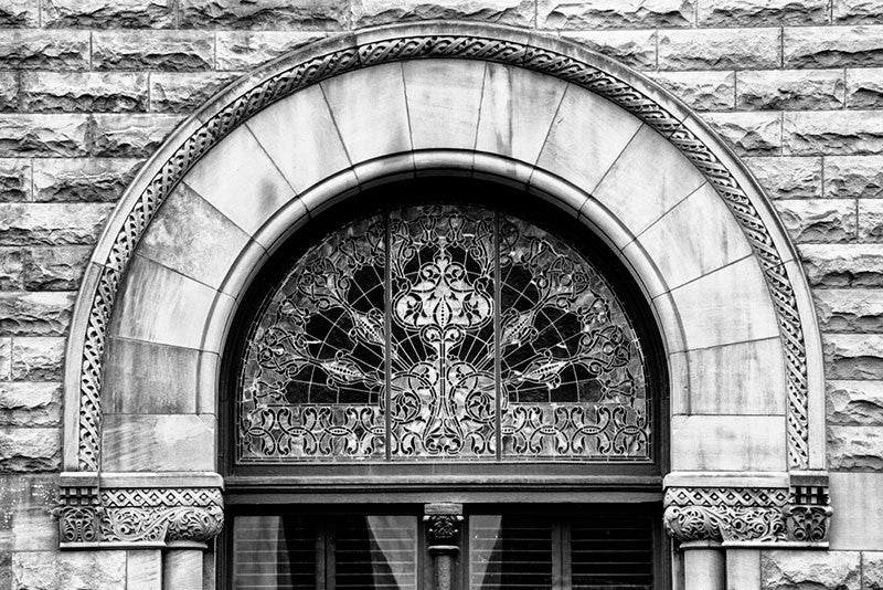 Black and white architectural detail photograph of an ornately decorated arched window on Nashville's historic Union Station.