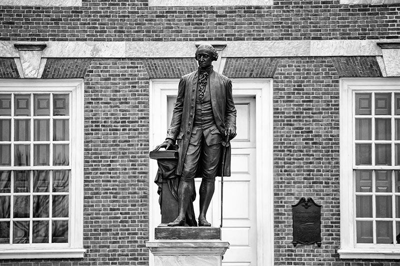 Black and white photograph of the statue of George Washington outside Independence Hall in Philadelphia.