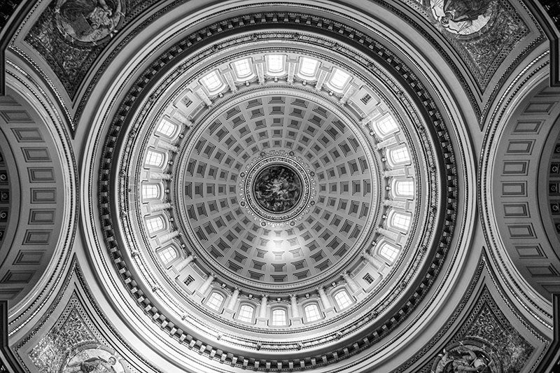 Black and white photograph looking up at the ornate interior dome inside the Wisconsin state house in Madison, Wisconsin.