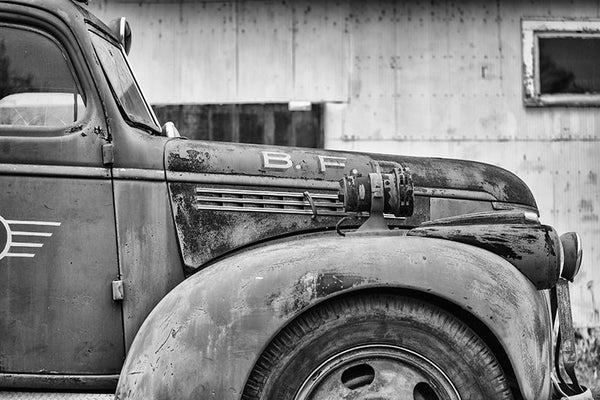 Black and white photograph of a faded red antique firetruck near Clarksdale, Mississippi.
