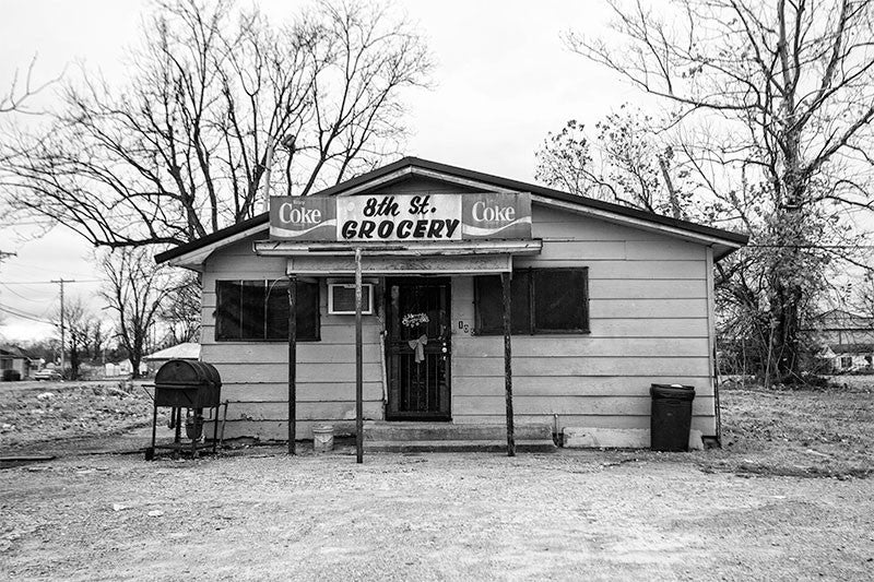 Black and white photograph of a small neighborhood store in downtown Clarksdale, Mississippi.