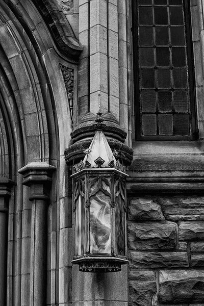 Black and white architectural detail photograph of an ornate lamp on the exterior of a historic church in Nashville, Tennessee.