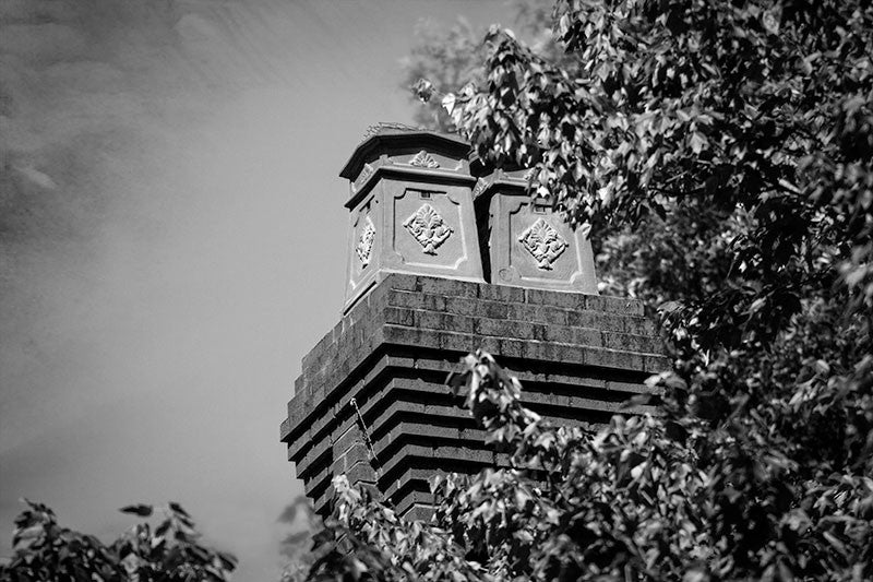 Black and white photograph of decorative chimneys on a historic home in Atlanta's leafy and eclectic Little Five Points neighborhood.
