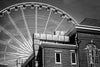 Black and white photograph of the giant white ferris wheel in downtown Atlanta, with the Tabernacle in the foreground.