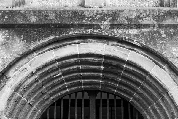 Black and white photograph of the repeated arches over the main entrance to the old Charleston County Jail, built in 1802 and in service until 1939.