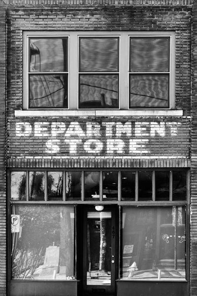 Black and white photograph of an old store front with extant painted "Department Store" sign on the red bricks. This building is in the same Atlanta neighborhood as the Martin Luther King, Jr. birthplace and his former church. Perhaps Dr. King even shopped in this store.