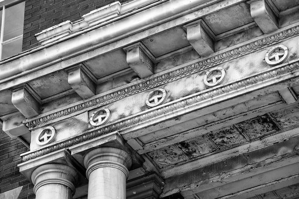 Black and white architectural detail photograph of the entrance of an decommissioned US Post Office building.