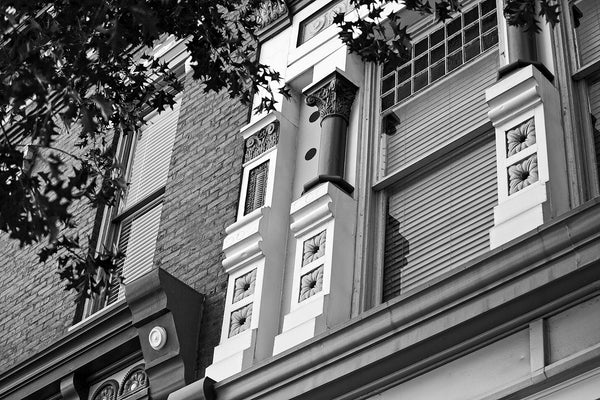 Black and white architectural detail photograph of the historic and beautifully ornate Italianate style architecture in downtown Florence, Alabama.