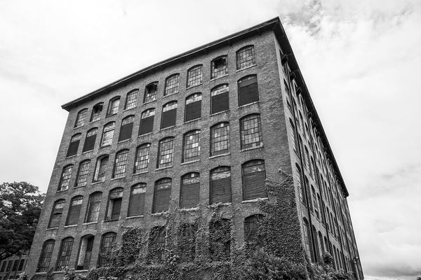 Black and white photograph of a former cotton and textile mill built in 1902 in North Carolina