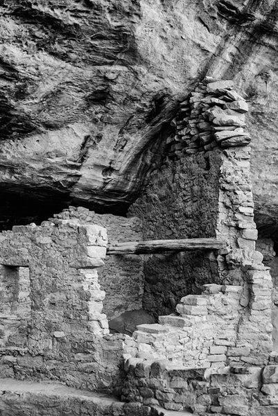 Black and white fine art photograph of a broken walls around rooms at the ancient site at Mesa Verde in Colorado.