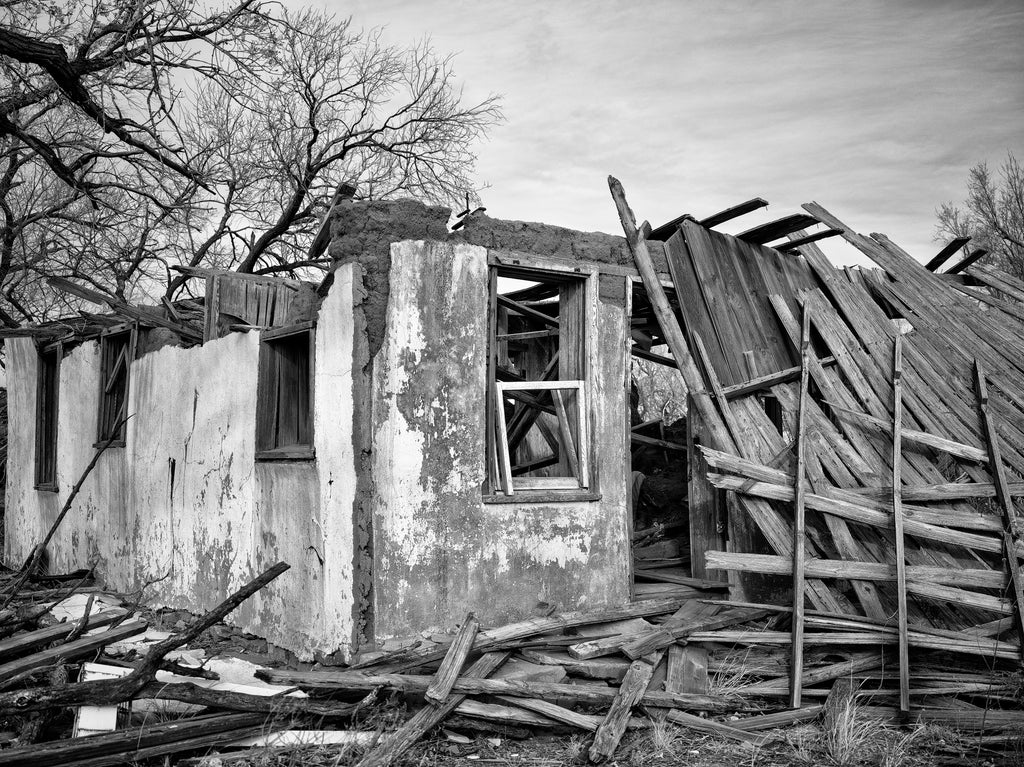 Black and white photograph of a collapsing adobe building found along old Route 66 in Glenrio, New Mexico, just steps away from the Texas state line.