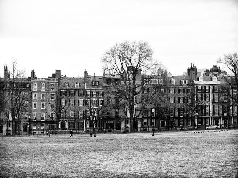 Black and white photograph of historic homes along Beacon Street as seen across Boston Common in downtown Boston.