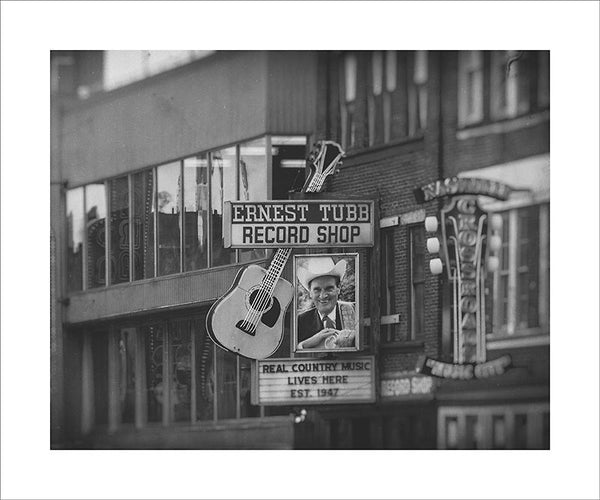 Black and white photograph of the honky tonk strip on Nashville's Broadway.  This photograph can be seen in the Nashville Room, a private dining room at Nashville's amazing Prima Restaurant in the Gulch neighborhood. At 16" x 20," this is the exact size and finish as the print at Prima -- just add your own top mat and framing.  This photograph is also available in other sizes. Go to the main Nashville gallery.