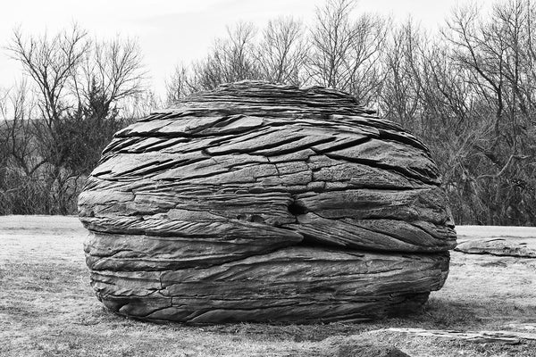 Black and white fine art photograph of an unusual round rock formation found on the landscape of the American prairie in Kansas.