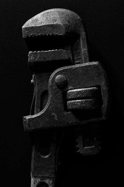 Black and white photograph of an old Lectrolite 14-inch pipe wrench made in Defiance, Ohio.