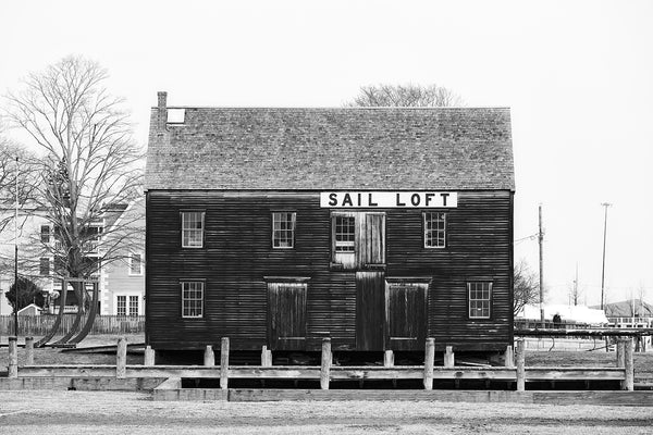 Black and white photograph of the old Pedrick Store House, which was built in the 1770s in Marblehead and recently relocated to the Salem Wharf.