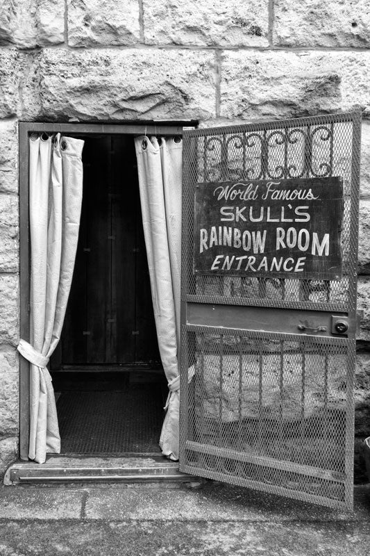 Black and white photograph of the entrance to "World Famous Skull's Rainbow Room," a long-time entertainment venue in Printer's Alley, downtown Nashville.