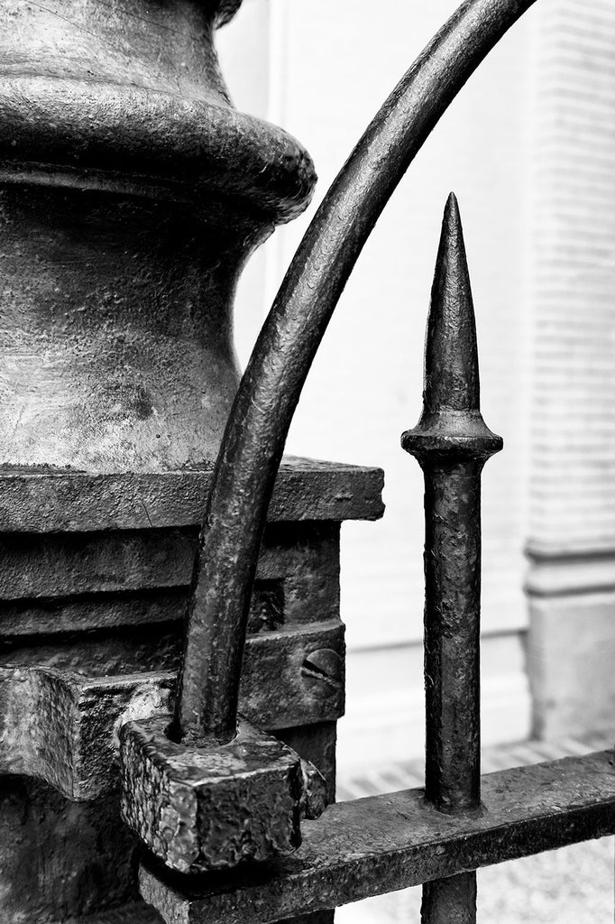Black and white detail photograph of an old black iron gate in downtown Nashville.