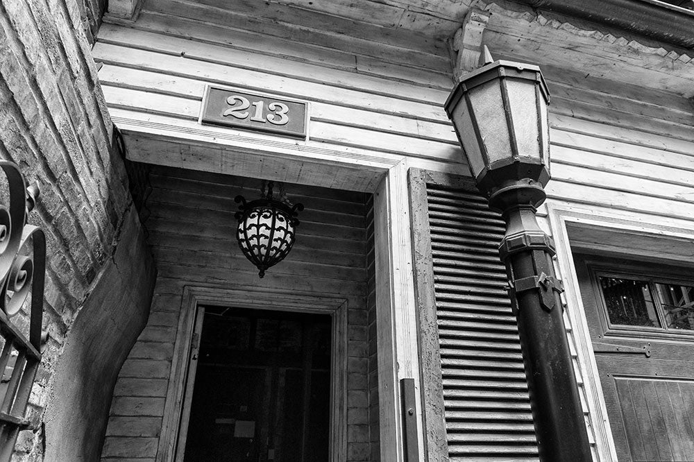 Black and white photograph of a doorway in Nashville's historic Printer's Alley entertainment district.