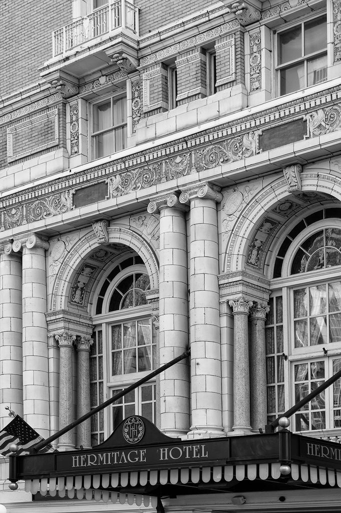 Black and white architectural photograph of the Beaux-arts exterior of Nashville's luxurious Hermitage Hotel, built in 1910. The hotel was host to elite clientele from presidents to entertainers, until it closed in 1977. It reopened in 1981, and has since been renovated to achieve its current high level of quality and service, making it the only AAA Five-Diamond hotel in Tennessee.