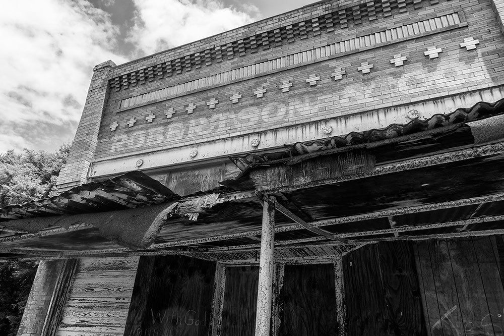 Black and white photograph of the old Robertson and Co. storefront in the abandoned downtown of tiny Adams, Tennessee. Adams is famous as the home of the Bell witch legend.