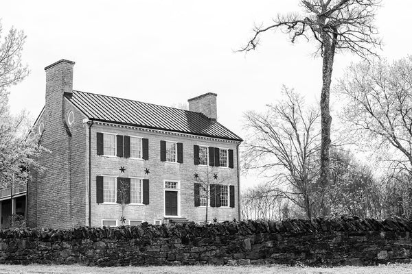 Black and white photograph the historic Cragfont House in Castalian Springs, Tennessee. The house was built between 1798 and 1802, by General James Winchester, who became one of the founders of Memphis.