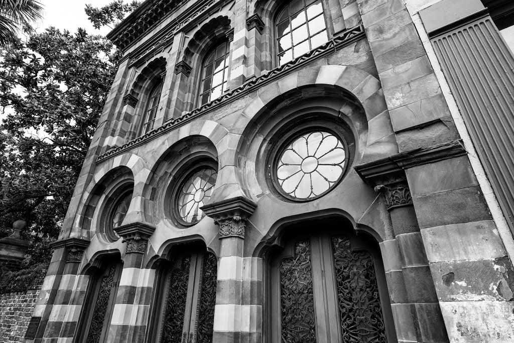 Black and white architectural photograph of the Moorish-inspired Farmer's and Exchange Bank with its detailed old ironwork window screens built 1854 in Charleston, South Carolina.