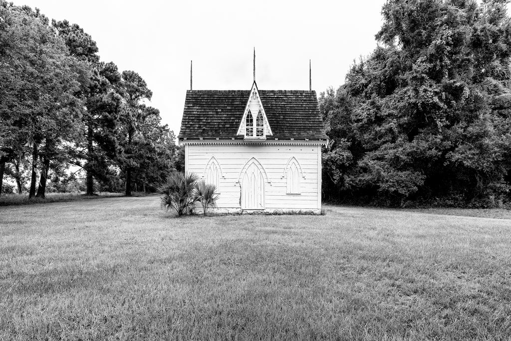 Black and white photograph of the historic wooden ice house from the historic Botany Bay farm near Charleston, South Carolina.