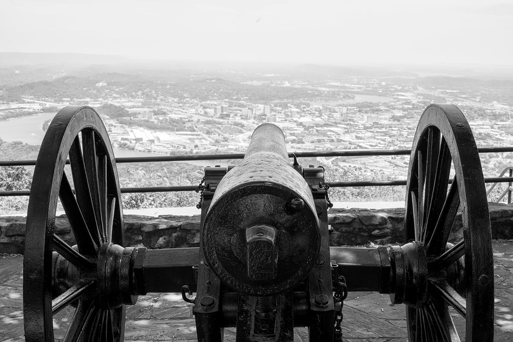 Black and white photograph of one of the iconic Civil War-era cannons still overlooking the city of Chattanooga from Pointe Park on top of Lookout Mountain.